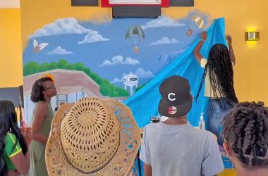 A mural created by two Hillcrest High students is unveiled during Gobble Doggs grand opening on Saturday, Aug. 9. (Summer Kiswani/ H-F Chronicle)
