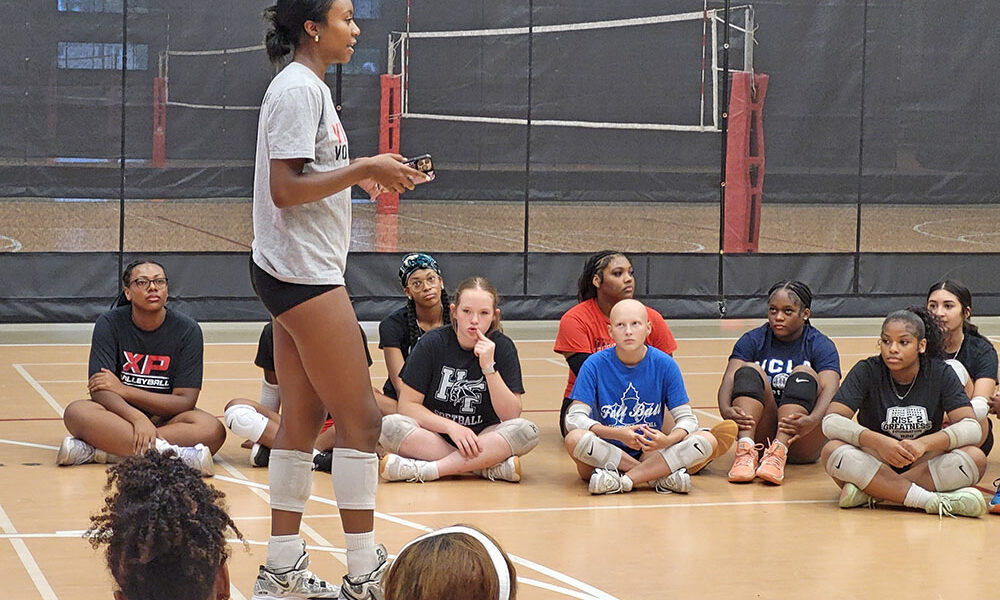 Senior Kymora Scott gives a speech to all levels of H-F girls volleyball before a joint practice Aug. 21. (David P. Funk/H-F Chronicle)