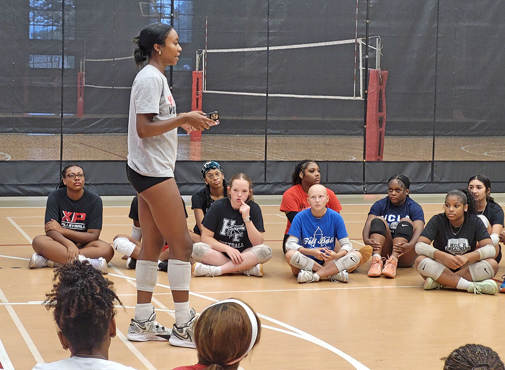 Senior Kymora Scott gives a speech to all levels of H-F girls volleyball before a joint practice Aug. 21. (David P. Funk/H-F Chronicle)