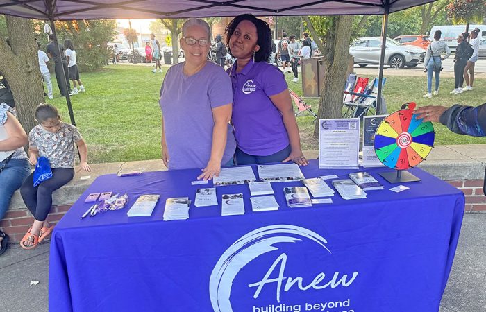 Lisa Jurgenson, left, and Ryiah Barnes operate the Anew: Building Beyond Violence and Abuse booth. (Nick Ulanowski / H-F Chronicle)