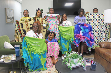 From left, Shaniya Charles, Jemiah Sykes, Amanda Thornton, Dakota Johnson, Chondra Wright, Javae Harris, Tyree Daniels, and Cinnamon Allison-Moore at the Project Kennedy Blanket Drive. (Nuha Abdessalam/H-F Chronicle)