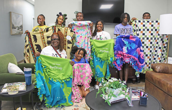 ProjectKennedy_BlanketDrive#1_web From left, Shaniya Charles, Jemiah Sykes, Amanda Thornton, Dakota Johnson, Chondra Wright, Javae Harris, Tyree Daniels, and Cinnamon Allison-Moore at the Project Kennedy Blanket Drive. (Nuha Abdessalam/H-F Chronicle)
