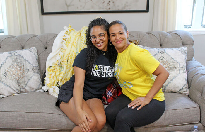 ProjectKennedy_BlanketDrive#3_web Ivelisse Serrano with her daughter, Arial Bransford, at the Project Kennedy blanket drive. (Nuha Abdessalam/H-F Chronicle)