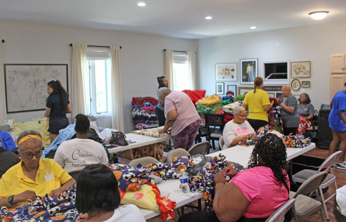 ProjectKennedy_BlanketDrive#4_web Volunteers fill the Cancer Support Center in Homewood, tying fleece blankets for children with cancer during Project Kennedy’s blanket drive. (Nuha Abdessalam/H-F Chronicle)