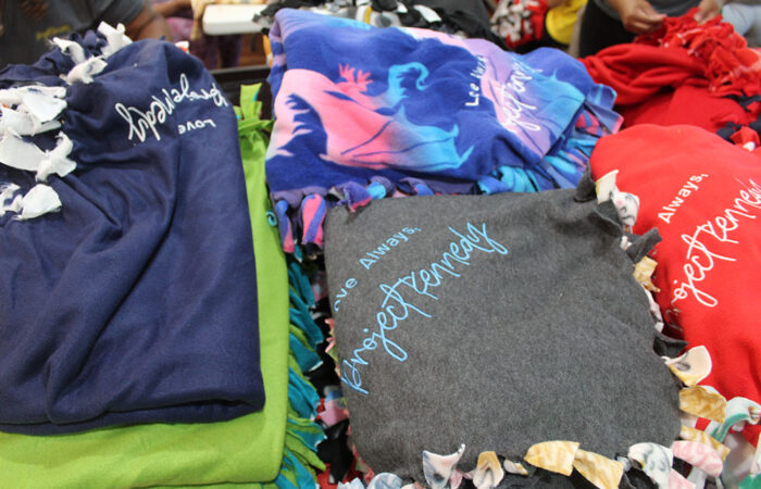 ProjectKennedy_BlanketDrive#9 Blankets, tied with care and stitched with Project Kennedy’s signature tag: "You are brave. You are loved." (Nuha Abdessalam/H-F Chronicle)