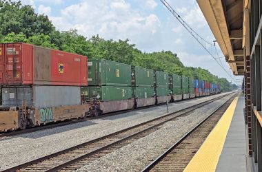 Intermodal rail cars move past Flossmoor train station on July 15. Homewood and Flossmoor were born as railroad towns and continue to be part of the busiest rail hub in the nation. (Eric Crump/H-F Chronicle)