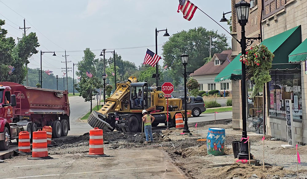 Crews excavate the new curb contour at the northwest corner of Sterling Avenue and Flossmoor Road on Thursday, July 31. The feature of the new streetscape that is intended to improve pedestrian safety at the intersection. (Eric Crump/H-F Chronicle)