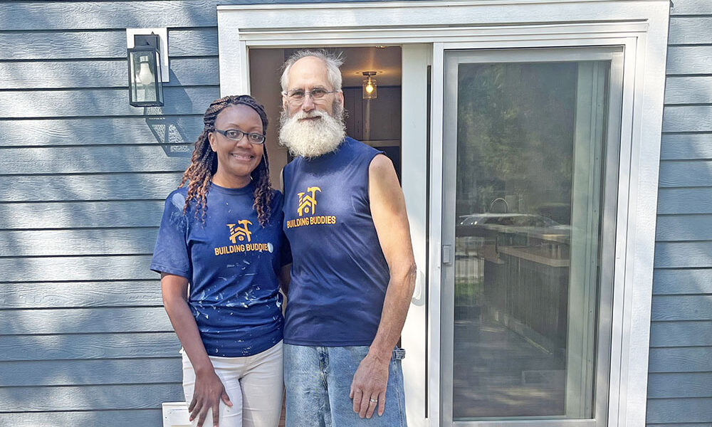 Sarana Lee, left, and Dan Warning stand on the deck of the house they built at 18462 Dixie Highway in Homewood. (Nick Ulanowski / H-F Chronicle)