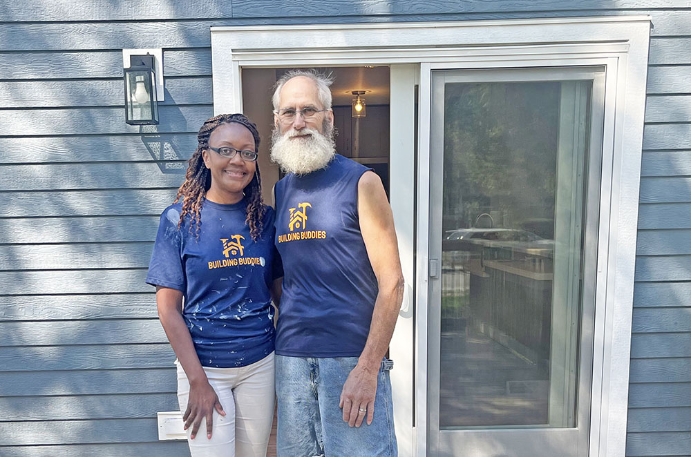 Sarana Lee, left, and Dan Warning stand on the deck of the house they built at 18462 Dixie Highway in Homewood. (Nick Ulanowski / H-F Chronicle)