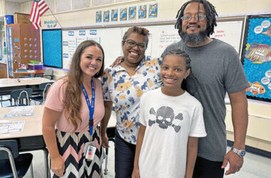 Teacher Brook Sanders, left, welcomed her fifth grade student Ciara Wilson and her parents, Cathy and Sidon Wilson, during Churchill School's open house. Sidon Wilson also attended Churchill School. (Marilyn Thomas/H-F Chronicle)