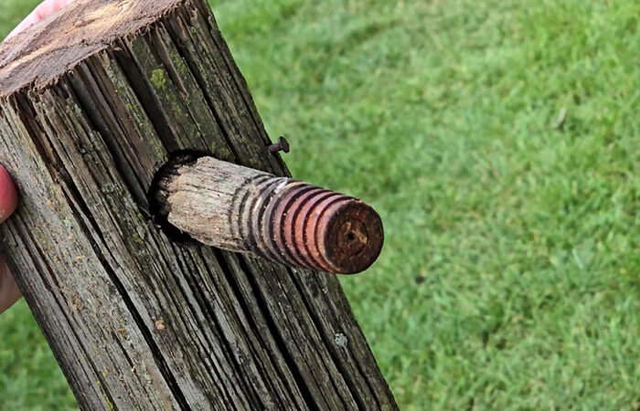 A close up of one of the telegraph pole cross arms that was removed Wednesday in preparation for construction of the new Flossmoor Veterans Memorial. (Eric Crump/H-F Chronicle)