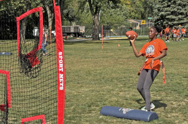 A student tests her passing ability during the Monsters Flag Football program Sept. 19 at Hart School. (Marilyn Thomas/H-F Chronicle)