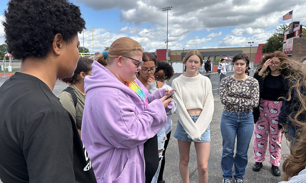 Molly Stapleton, a senior at Homewood-Flossmoor High, shares information about a 10-year-old who died by gun violence. About 30 students gathered on campus as part of a national Students Demand Action rally demanding an end to gun violence. (Marilyn Thomas/H-F Chronicle)