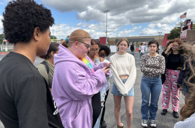 Molly Stapleton, a senior at Homewood-Flossmoor High, shares information about a 10-year-old who died by gun violence. About 30 students gathered on campus as part of a national Students Demand Action rally demanding an end to gun violence. (Marilyn Thomas/H-F Chronicle)