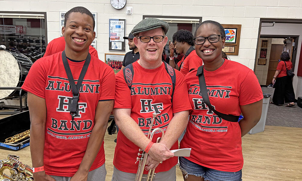 Homewood-Flossmoor High band alumni, from left, Jeremy Wesley, Corey O'Donnell and Kalynn Hunter were among the alumni at the band reunion Sept. 19. (Marilyn Thomas/H-F Chronicle)