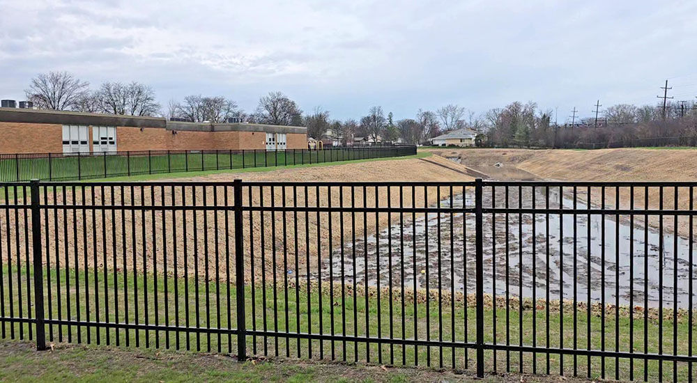 This photo looks north from the southern end of the Heather Hill storm water detention basin, which was completed last year. Flossmoor trustees have discussed but not decided whether the basin shoiuld be monitored by cameras. (Eric Crump/H-F Chronicle)