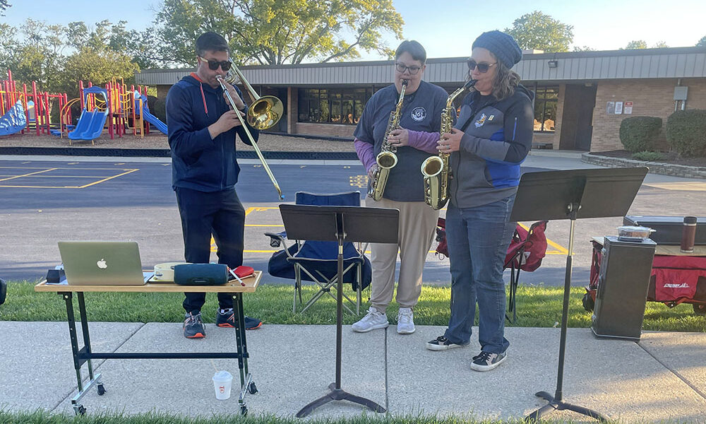 Local musicians play music to help motivate passing runners in the Hidden Gem Half Marathon. (Jamilah Lewis/H-F Chronicle)