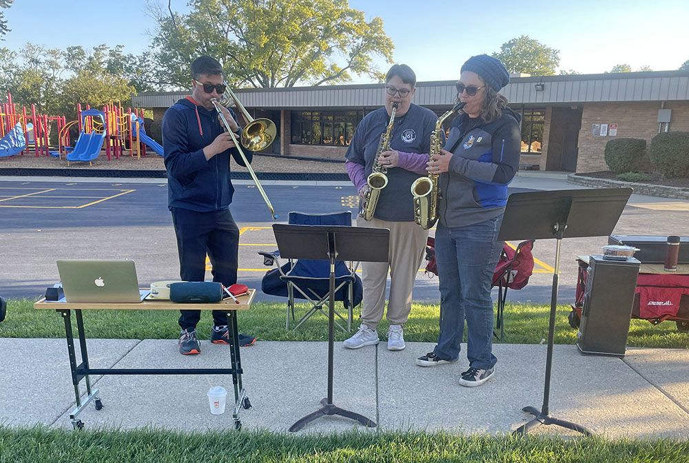 Local musicians play music to help motivate passing runners in the Hidden Gem Half Marathon. (Jamilah Lewis/H-F Chronicle)