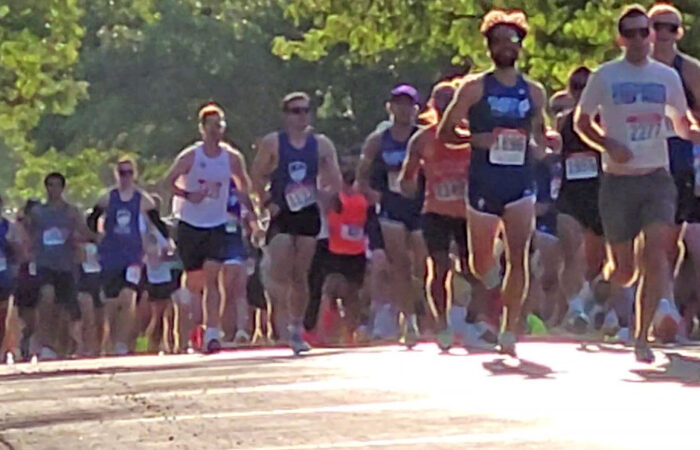 Runners head west on Flossmoor Road toward Governors Highway early in the Hidden Gem Half Marathon. (Eric Crump/H-F Chronicle)