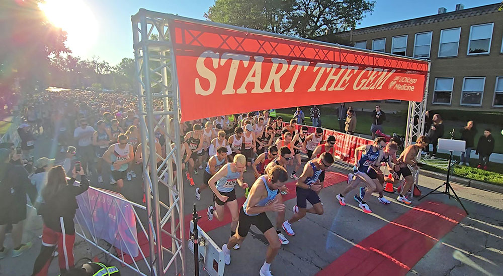 Runners launch themselves west on Flossmoor Road as the Hidden Gem Half Marathon starts at 7:30 a.m. Saturday, Sept. 6, (Eric Crump/H-F Chronicle)