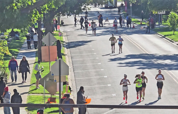 Runners head west from Brassie Avenue toward the viaduct on Flossmoor Road. (Eric Crump/H-F Chronicle)