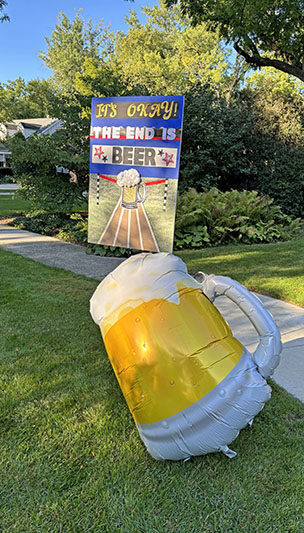 A reminder that beer was available at the end of the Hidden Gem Half Marathon race. (Marilyn Thomas/H-F Chronicle)