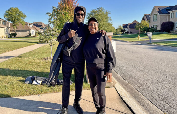 Debora and Walter Matthews, Flossmoor residents, arrive with chairs in hand to cheer on runners during the Hidden Gem Half Marathon. (Nuha Abdessalam/H-F Chronicle)