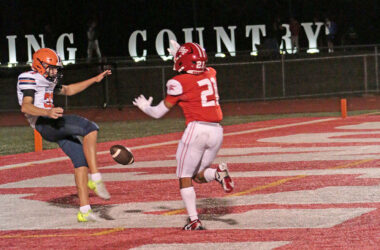 William Bundy (No. 21) breaks through and blocks a punt in the end zone, resulting in a touchdown. (Benjamin Faoro/H-F Chronicle)