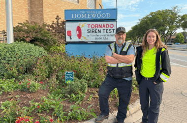 Homewood Arborist Bryon Doerr (left) and Homewood Public Works member Katie Becker (right) stand in front of the native species landscape that they planted outside Village Hall. (Summer Kiswani/ H-F Chronicle)