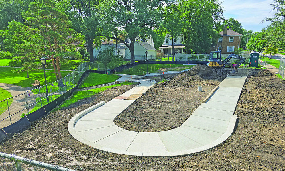 The new ADA-compliant ramp is under construction in this Aug. 23 photo. The ramp is designed to make Irwin Park more accesssible from the west side Gottschalk Avenue entrance, which previously included only stairs. (Eric Crump/H-F Chronicle)