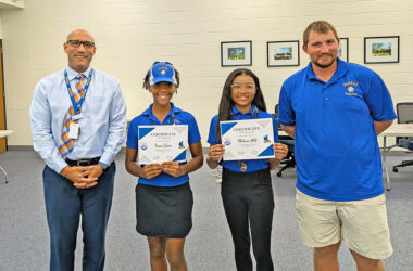 From left, Superintendent Dana Smith stands with IESA State Golf participants Imani Green, Wakana Hill, and Coach Michael Shereyk. (Chris Weber/H-F Chronicle)