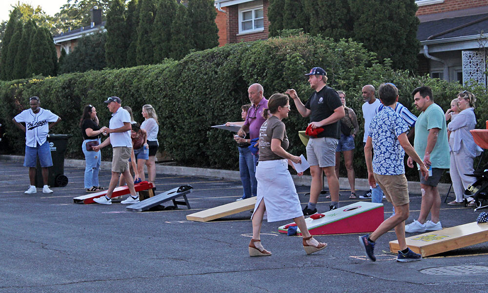 Nothing but (hopefully) net. Bean bags fly during the OAKtoberfest tournament in Flossmoor. (Nuha Abdessalam/H-F Chronicle)