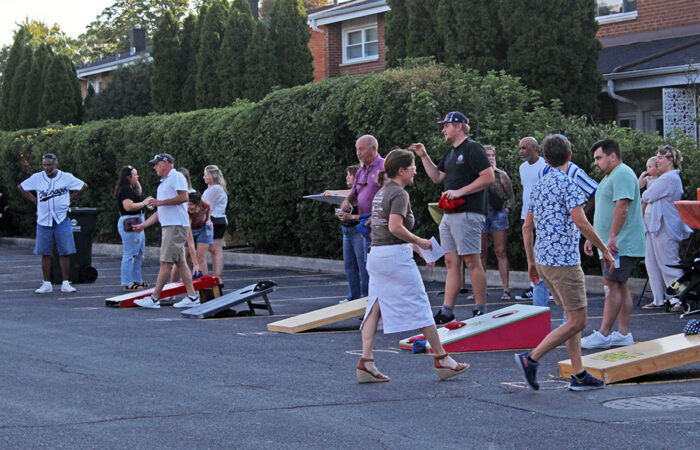 Nothing but (hopefully) net. Bean bags fly during the OAKtoberfest tournament in Flossmoor. (Nuha Abdessalam/H-F Chronicle)