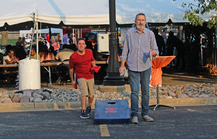 Game faces on. Anthony Tabascio and partner Mike, during a tense match at the OAKtoberfest bags tournament. (Nuha Abdessalam/H-F Chronicle)