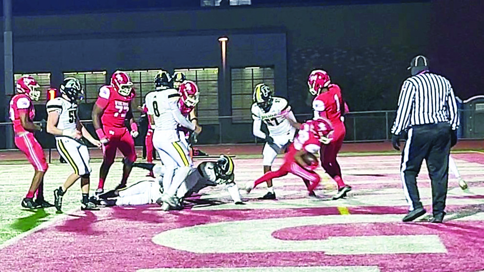 Senior Kourtney Smith scores on a 10-yard run in Homewood-Flossmoor's 50-8 win over Metea Valley Friday. (David P. Funk/H-F Chronicle)