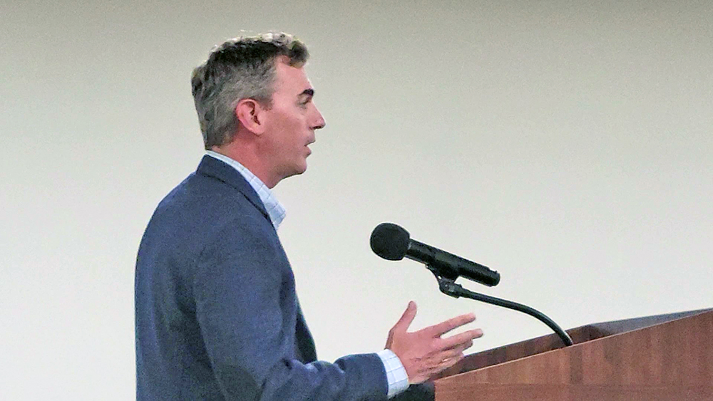 Kyle Schott, vice president of real estate development for Ryan Companies, introduces the company to Hazel Crest trustees on Oct. 14. The company is in the process of purchasing Calumet Country Club and plans to redevelop the property. (Eric Crump/H-F Chronicle)
