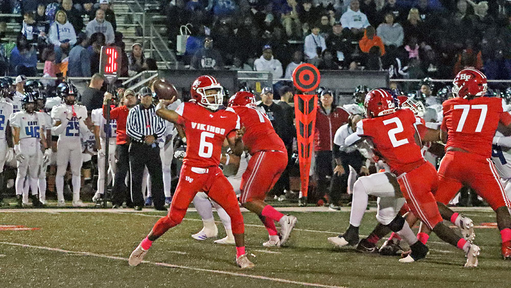Rahsaan Coleman (6) looks to start a drive through the air as the Vikings fight to battle back against Lincoln-Way East on Oct. 10. (Benjamin Faoro/H-F Chronicle)