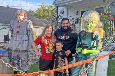Jimmy Marinez, his wife Alisha and his son Rex in his yard heavily decorated with Halloween decorations at 1735 Ridge Road in Homewood. (Nick Ulanowski / H-F Chronicle)