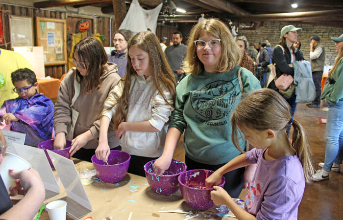 Participants make slime during Walk Walton at Izaak Walton Preserve. Members of Girl Scout Troop 65572 from Orland Park were in on the slime-making. (Nuha Abdessalam/H-F Chronicle)