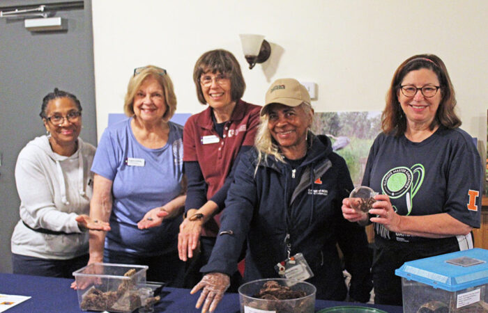 The Master Gardeners of the University of Illinois Extension, from left: Cindy Wade-Mayo, Regina Zohfeld, Annette Pletcher, Karen McCray, and Margaret Burns-Westmeyer. brought their insect exhibit to Walk Walton. (Nuha Abdessalam/H-F Chronicle)
