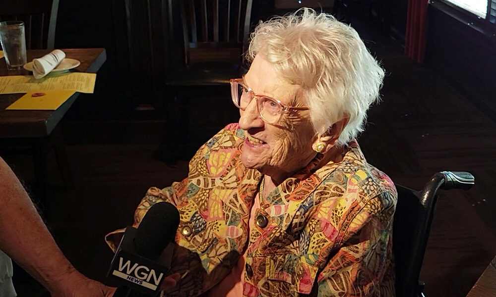 Mary Cantway is interviewed by a WGN TV reporter at her 111th birthday party Sept. 30. (Eric Crump/H-F Chronicle)