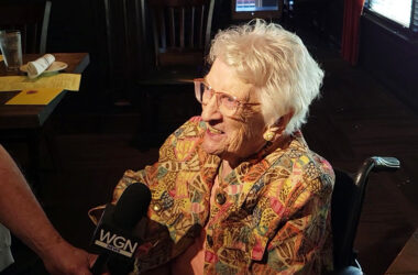 Mary Cantway is interviewed by a WGN TV reporter at her 111th birthday party Sept. 30. (Eric Crump/H-F Chronicle)