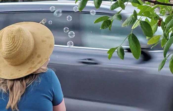 A protester at the No Kings rally in Beverly blows bubbles in a display of the whimsy interspersed with anger at the Trump administration. (Eric Crump/H-F Chronicle)