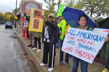 A protester holds a sign that reads, "All American like apple pie, jazz, baseball and anti-fascism" at the No Kings demonstration in Beverly on Oct. 18. (Eric Crump/H-F Chronicle)