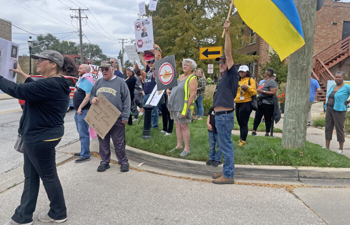 Protesters gathers near the veterans memorial on Harwood Avenue during the No Kings protest Oct. 18 in Homewood. (Jamilah Lewis/H-F Chronicle)