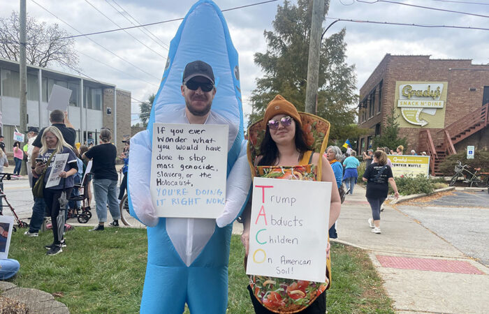 Homewood residents Aaron and Megan Daily came in costume to the No Kings protest Oct. 18 in Homewood. (Jamilah Lewis/H-F Chronicle)