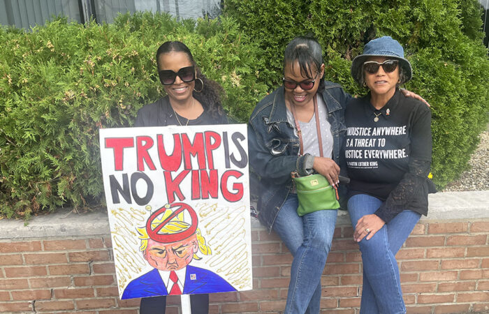 Homewood resident Renita Davis, left, with an unnamed friend, center, and Carolyn Wane, right, at the No Kings rally in Homewood on Oct. 18. (Nick Ulanowski / H-F Chronicle)