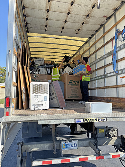 Another TV is stacked on the truck from the CHaRM Center at Recyclepalooza. Electronics are the most popular thing to recycle. (Marilyn Thomas/H-F Chronicle)