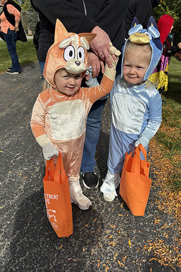 Two-year-old twins Lilianna, left, and Bobbi Allen of Homewood came as cartoon characters Bingo and Bluey. (Marilyn Thomas/H-F Chronicle)