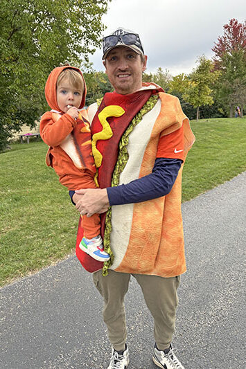 Hot dog treats large and small, thanks to Eric Beesley and his son Emerson, 2, of Homewood. (Marilyn Thomas/H-F Chronicle)